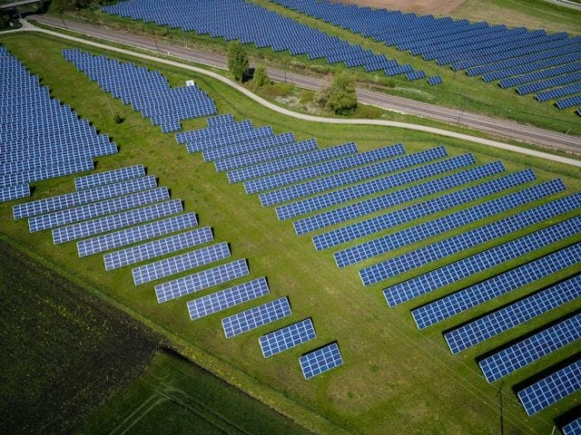 fields covered in solar panels - sustainability